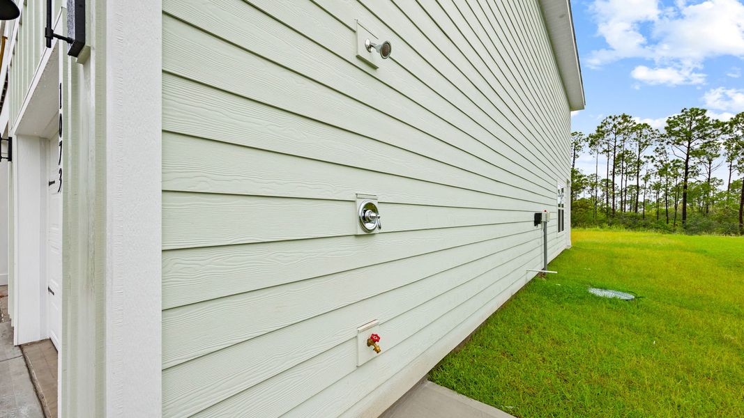 Representative exterior details of a home built from the The Monroe by D.R. Horton in WindMark Beach, Port Saint Joe (Image 23).