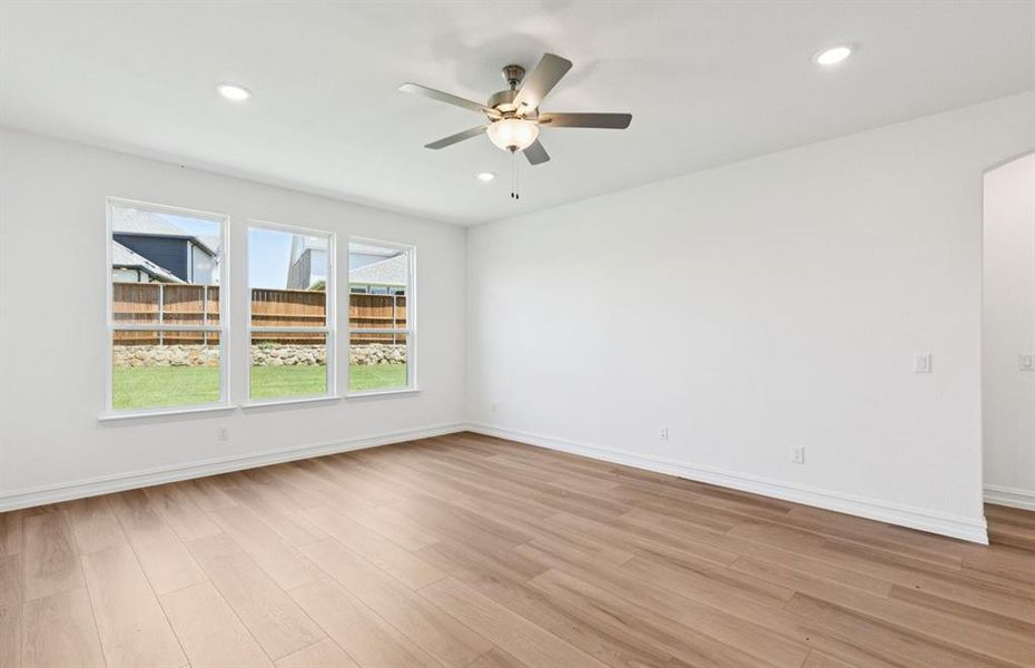 Bright gathering room with large windows *real home pictured