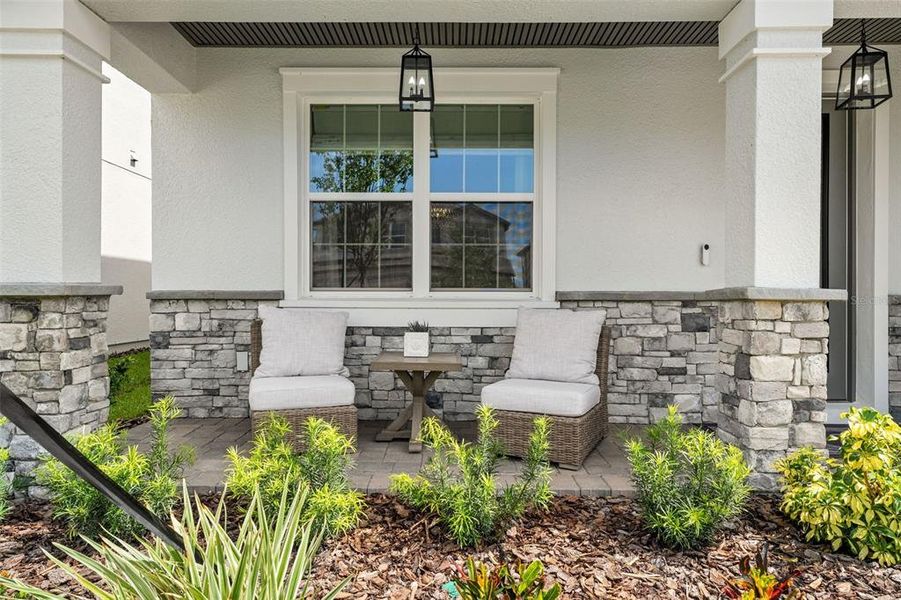 Front exterior of a new home in Whispering Oaks Preserve, Wesley Chapel, FL, highlighting curb appeal (Image 26).