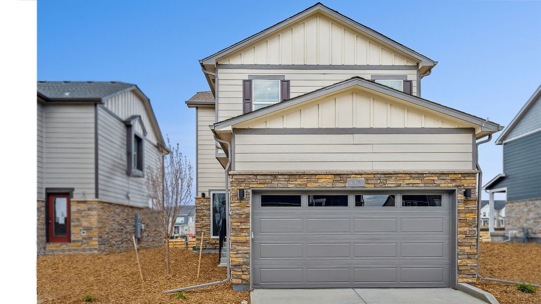 Front exterior of a new home in Sky Ranch, Watkins, CO, highlighting curb appeal (Image 2).