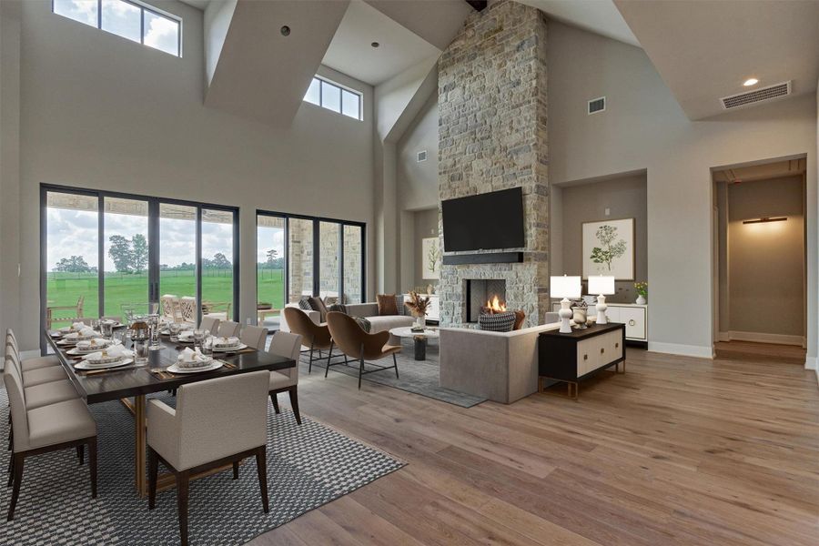 Gorgeous den! Wall of sliding glass doors that open to the large outdoor living area, summer kitchen with seating and expansive private view! Photo is virtually staged/enhanced. Gorgeous den! Wall of sliding glass doors that open to the large outdoor living area, summer kitchen with seating and expansive private view! Photo is virtually staged/enhanced.