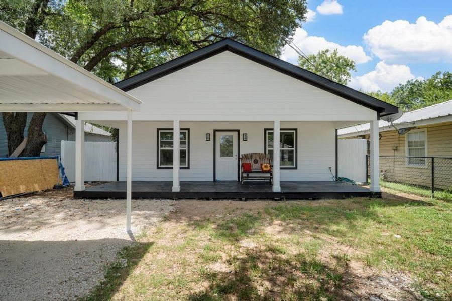 Rear view of property with covered porch Rear view of property with covered porch