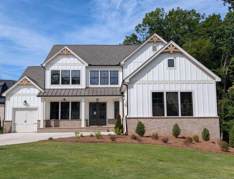 Front exterior of a new home in White Post on Lake Lanier, Gainesville, GA, highlighting curb appeal (Image 2). Front exterior of a new home in White Post on Lake Lanier, Gainesville, GA, highlighting curb appeal (Image 2).