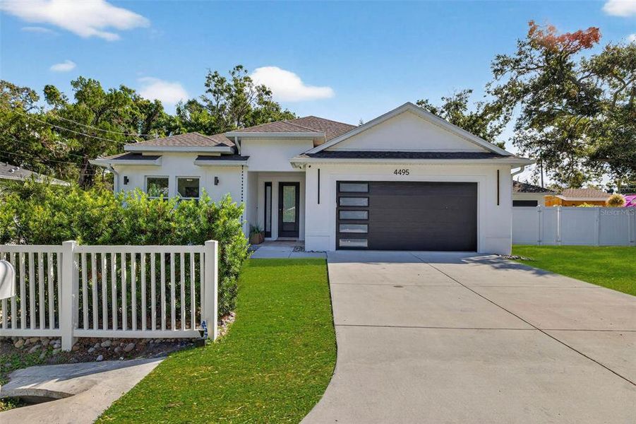 Front exterior of a new home in , St. Petersburg, FL, highlighting curb appeal (Image 1). Front exterior of a new home in , St. Petersburg, FL, highlighting curb appeal (Image 1).