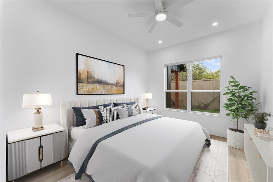 Bedroom featuring light wood-type flooring, a ceiling fan, and recessed lighting