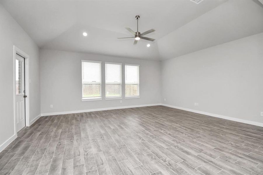 Another view of family room area. Sample photo of completed home with similar floor plan. Actual colors and selections may vary.