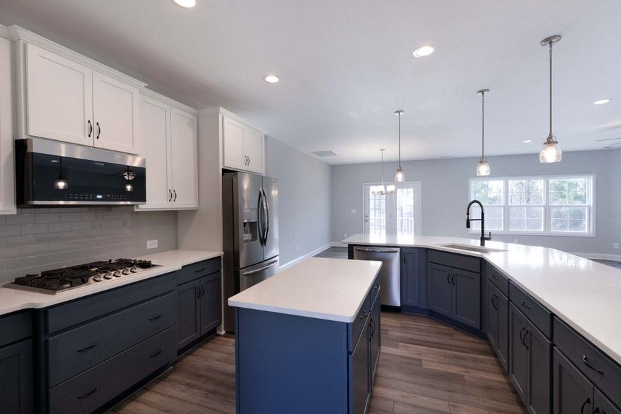 Gourmet kitchen and two-tone cabinets