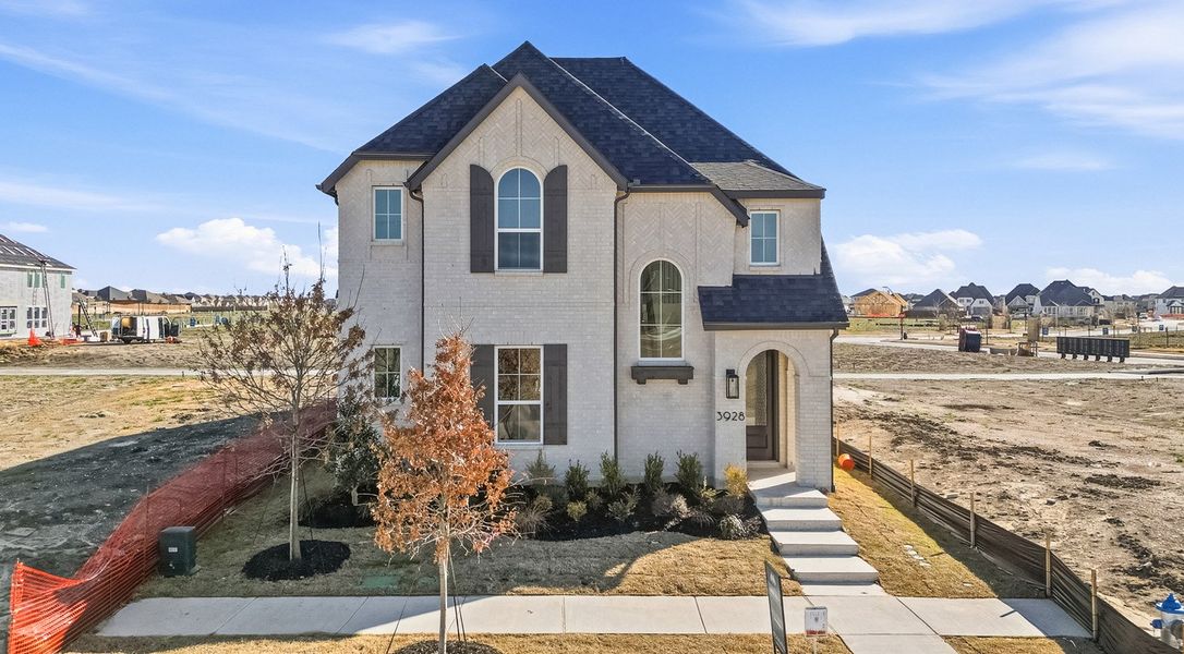 Front exterior of a new home in Mosaic, Celina, TX, highlighting curb appeal (Image 1). Front exterior of a new home in Mosaic, Celina, TX, highlighting curb appeal (Image 1).