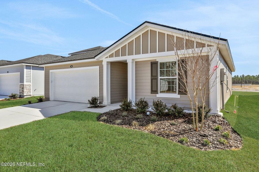 Front exterior of a new home in Bellbrooke, Jacksonville, FL, highlighting curb appeal (Image 20).