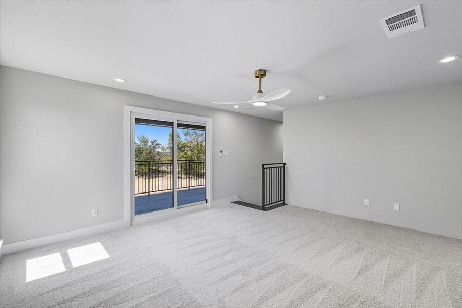 Spare room with recessed lighting and light colored carpet