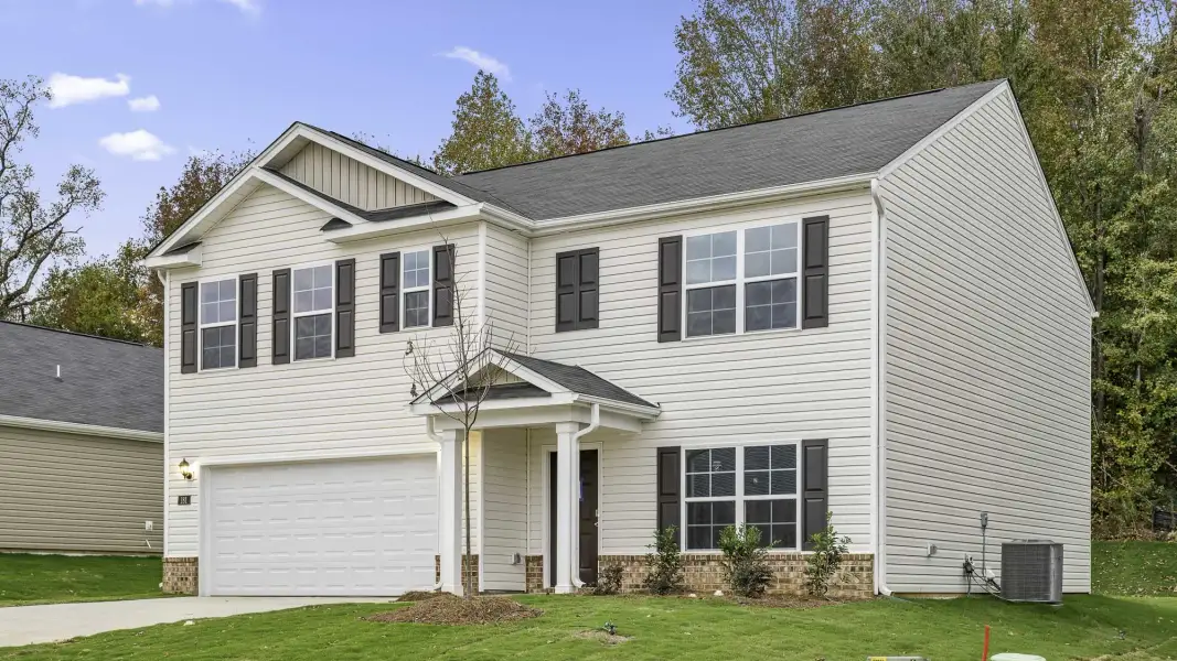 Front exterior of a new home in Mangum Farms, Stem, NC, highlighting curb appeal (Image 20).