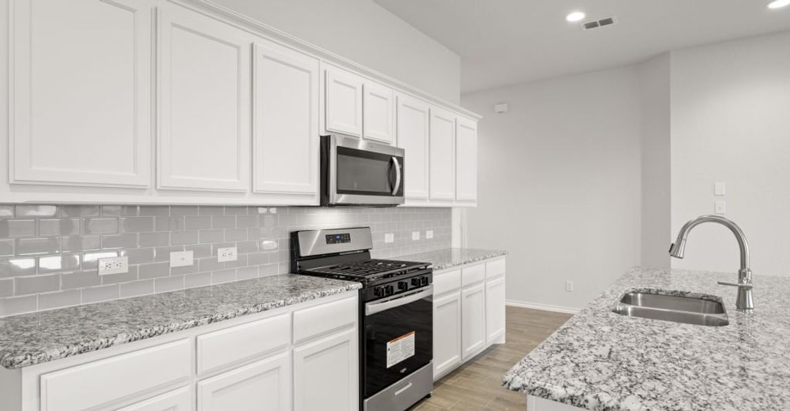 Representative exterior photo of a completed home built from the Lincoln by Impression Homes in Baker Farms, Cleburne, TX (Image 8).