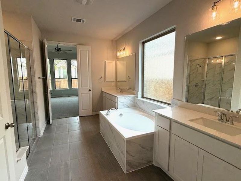 Primary Bath retreat with walk-in shower, garden tub & dual vanities