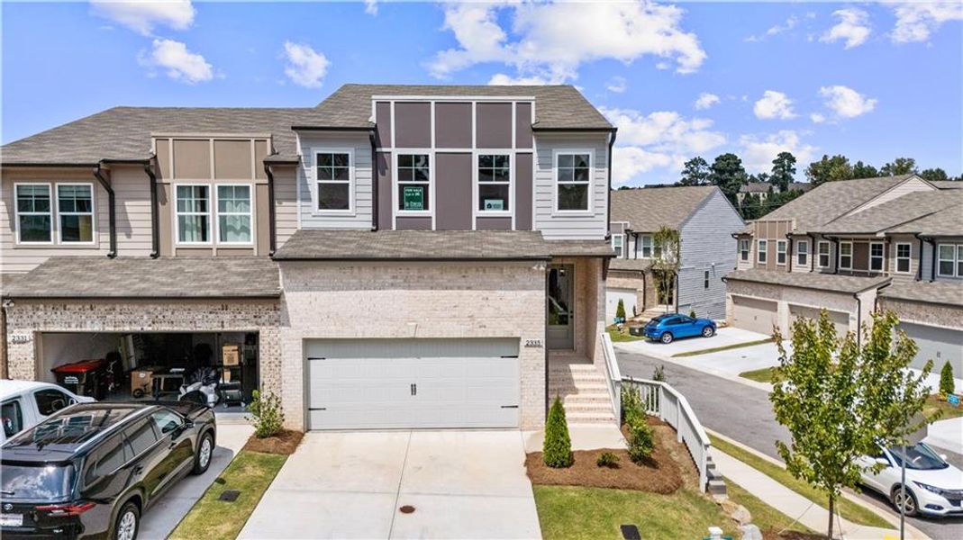 Front exterior of a new home in The Collection at Vinings, Atlanta, GA, highlighting curb appeal (Image 15). Front exterior of a new home in The Collection at Vinings, Atlanta, GA, highlighting curb appeal (Image 15).