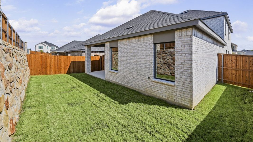 Exterior details and patio area of a home in Windchime, Celina (Image 3).