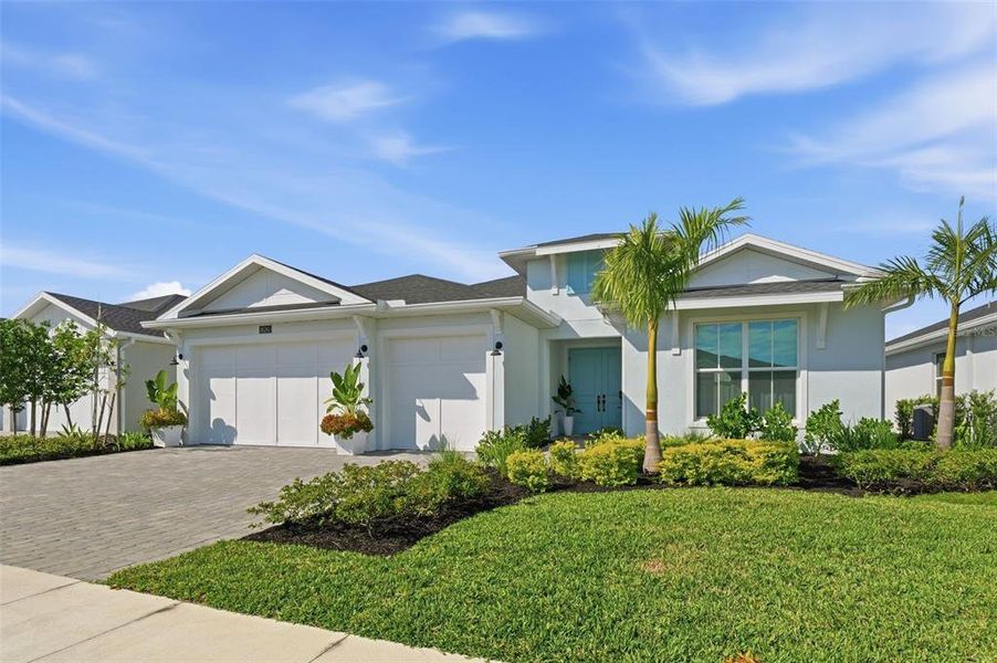 Front exterior of a new home in , Punta Gorda, FL, highlighting curb appeal (Image 2).