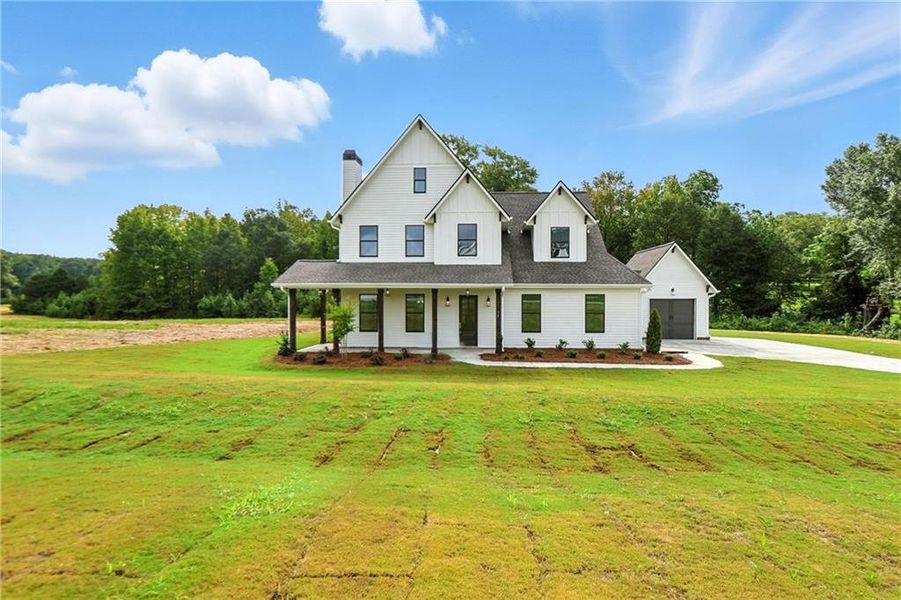 Front exterior of a new home in Old Town Estates, Dacula, GA, highlighting curb appeal (Image 34).