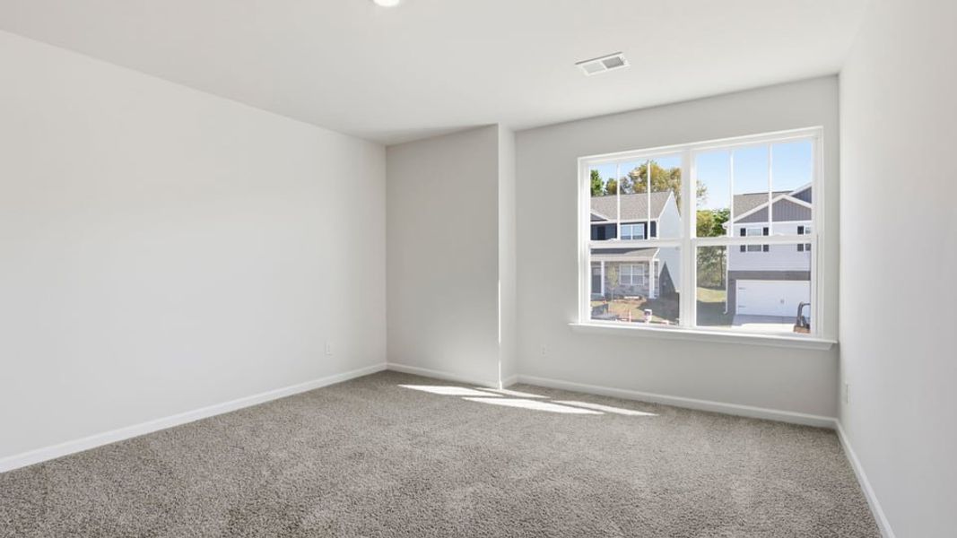Spacious, unfurnished interior of a new home in Durbin Meadows Traditions, Fountain Inn (Image 31).