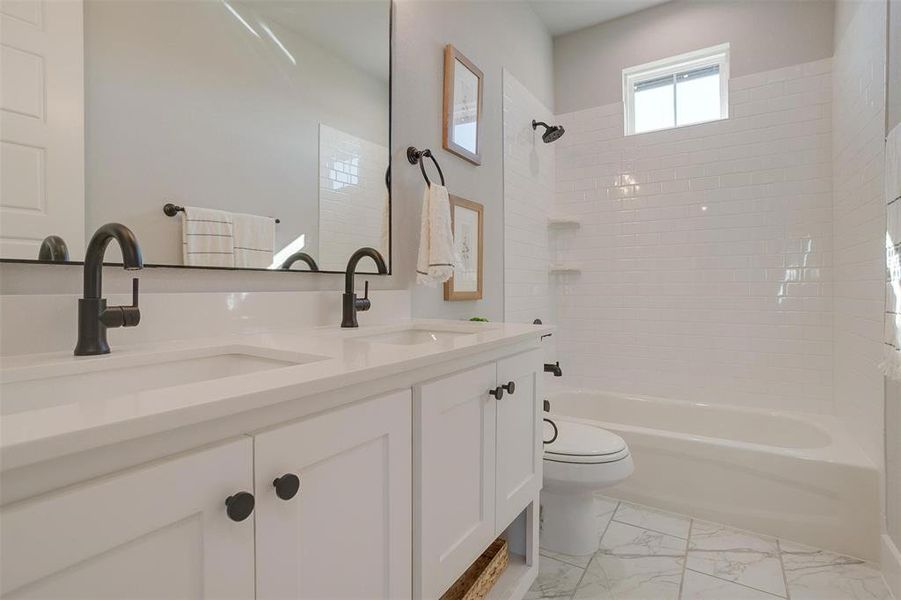 Full bathroom with vanity, toilet, and bathing tub / shower combination