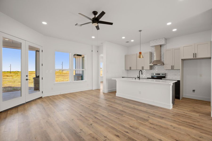 A spacious, naturally illuminated great room with a well-appointed kitchen island awaits. A spacious, naturally illuminated great room with a well-appointed kitchen island awaits.