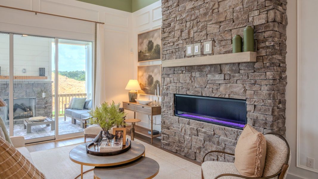 Gathering room with fireplace and access to rear porch Gathering room with fireplace and access to rear porch