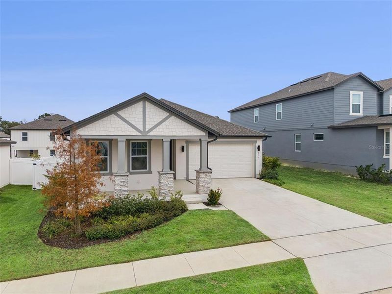 Front exterior of a new home in , Minneola, FL, highlighting curb appeal (Image 27).