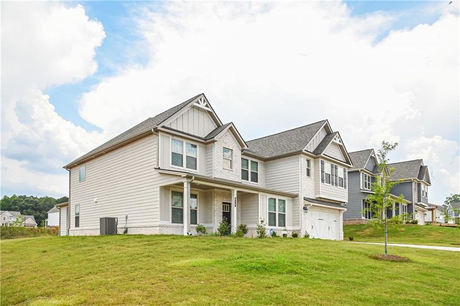 Front exterior of a new home in , Stockbridge, GA, highlighting curb appeal (Image 31).