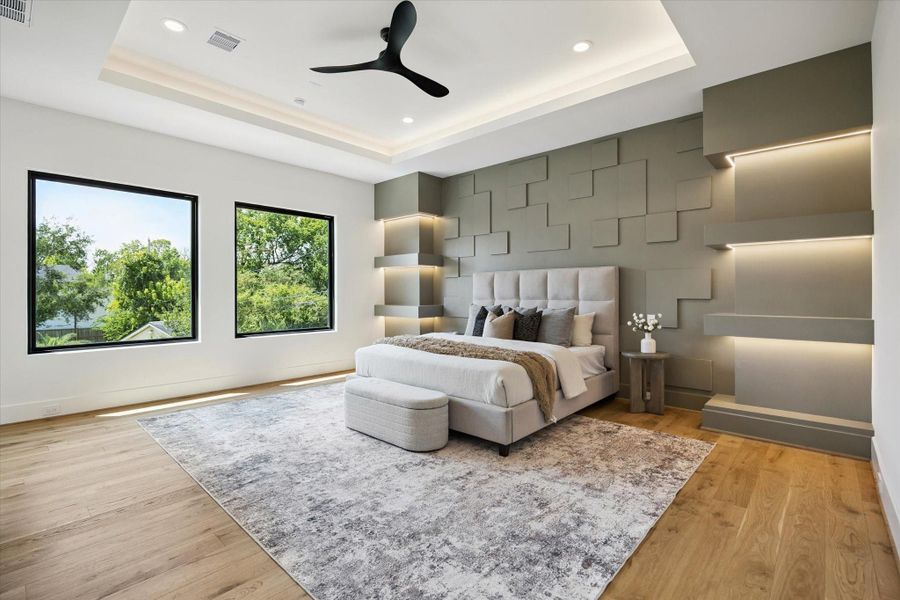 Elegant owners' retreat with hardwood floors, abundant natural light and an accent wall finish with under lighting touch. Elegant owners' retreat with hardwood floors, abundant natural light and an accent wall finish with under lighting touch.