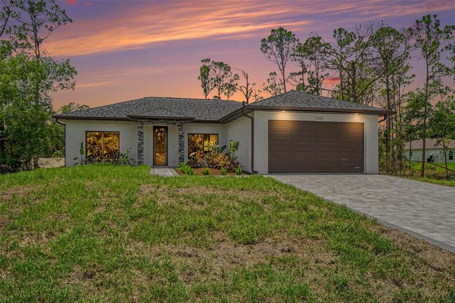Front exterior of a new home in , Port Charlotte, FL, highlighting curb appeal (Image 1). Front exterior of a new home in , Port Charlotte, FL, highlighting curb appeal (Image 1).