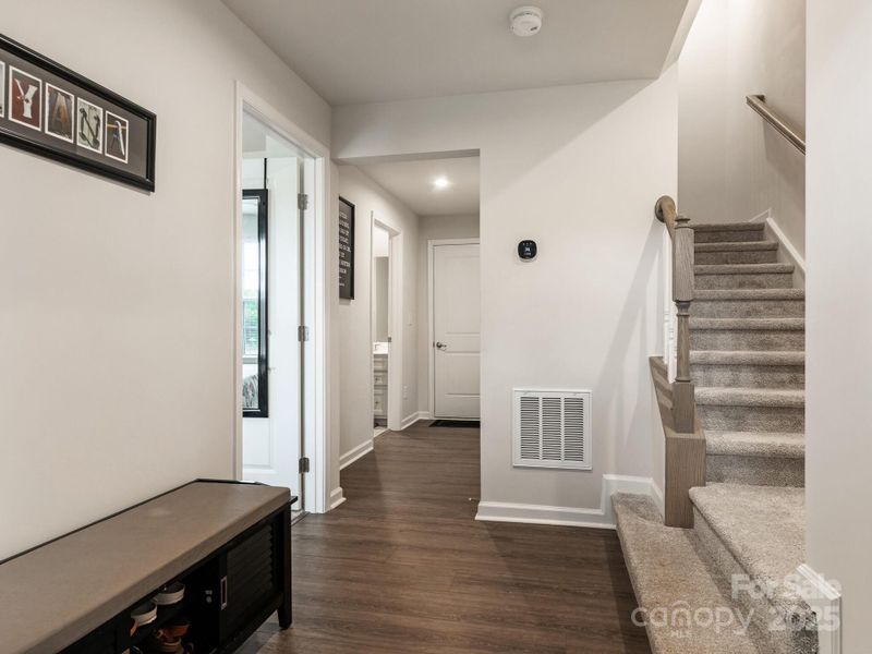 Lower level provides a bedroom, full bath, two car garage, and extra storage.