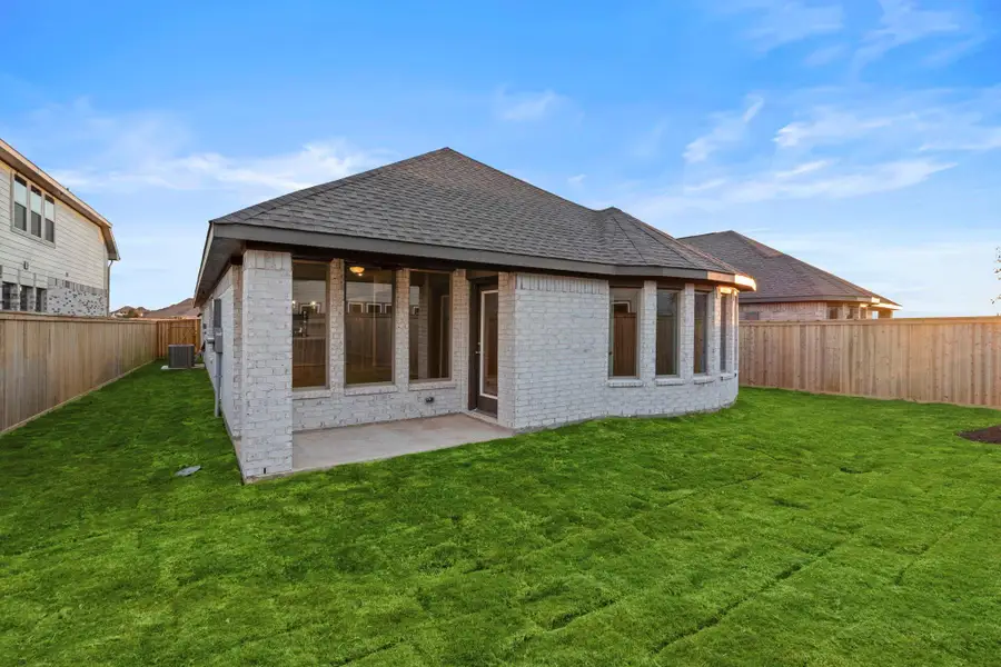 Exterior details and patio area of a home in Bridgeland, Cypress (Image 19).