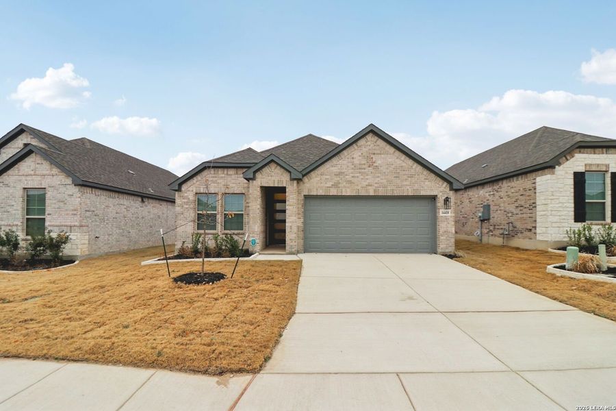 Front exterior of a new home in Kallison Ranch, San Antonio, TX, highlighting curb appeal (Image 24).