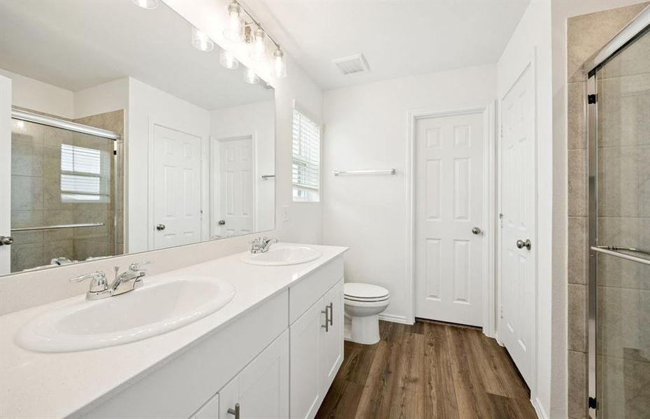 Owner's private bath with double vanity