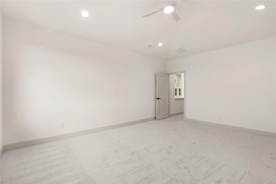 Secondary bedroom with carpet, ceiling fan, and open layout Secondary bedroom with carpet, ceiling fan, and open layout