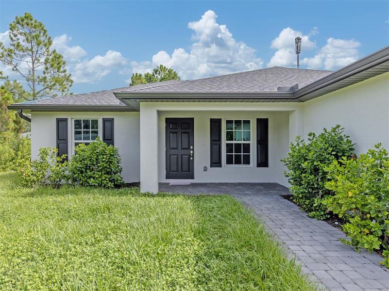 Exterior details and patio area of a home in , Port Charlotte (Image 26).