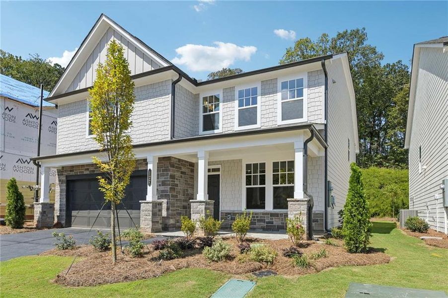 Front exterior of a new home in Creekside, Dawsonville, GA, highlighting curb appeal (Image 1).