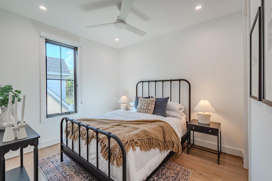 Bedroom featuring light wood-type flooring, recessed lighting, and ceiling fan
