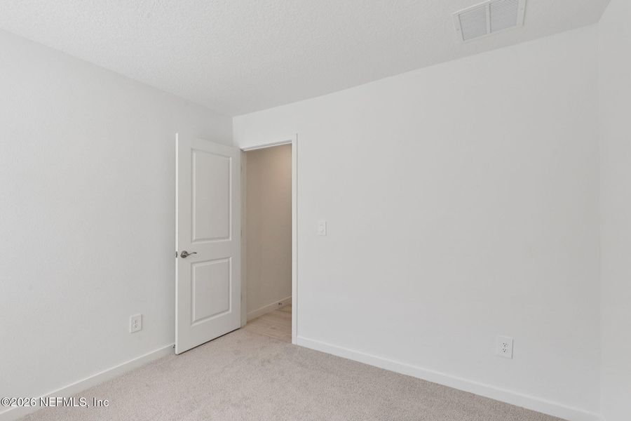 Spacious, unfurnished interior of a new home in Colbert Landings, Palm Coast (Image 22).