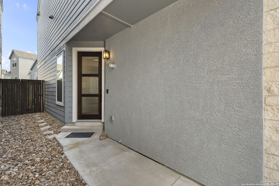 Exterior details and patio area of a home in The Enclave at Whitby, San Antonio (Image 20). Exterior details and patio area of a home in The Enclave at Whitby, San Antonio (Image 20).