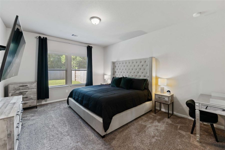 The primary suite is a true owner’s retreat, featuring a spacious layout with soft natural light and room for a king-sized bed plus sitting area. The primary suite is a true owner’s retreat, featuring a spacious layout with soft natural light and room for a king-sized bed plus sitting area.