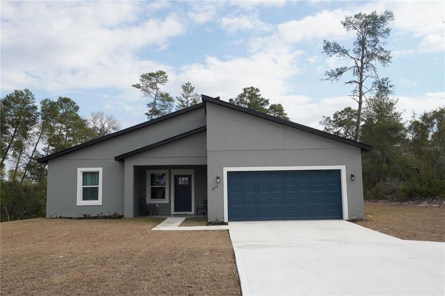 Front exterior of a new home in , Ocala, FL, highlighting curb appeal (Image 24).