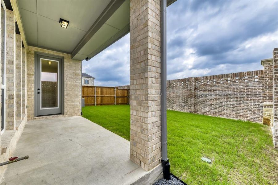 Covered patio with a concrete surface and recessed lighting