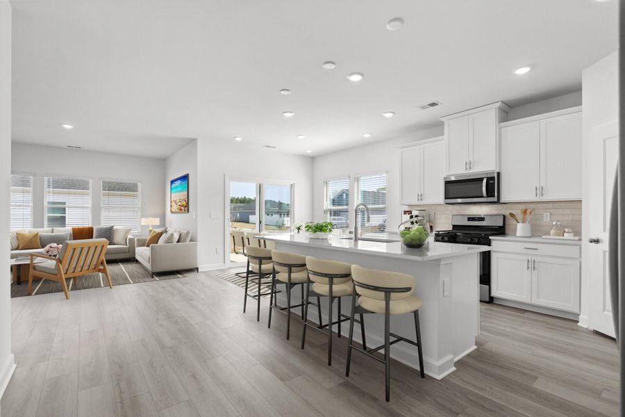 Furnished interior view inside a new home in The Coves at Lakes of Cane Bay, Summerville (Image 12). Furnished interior view inside a new home in The Coves at Lakes of Cane Bay, Summerville (Image 12).