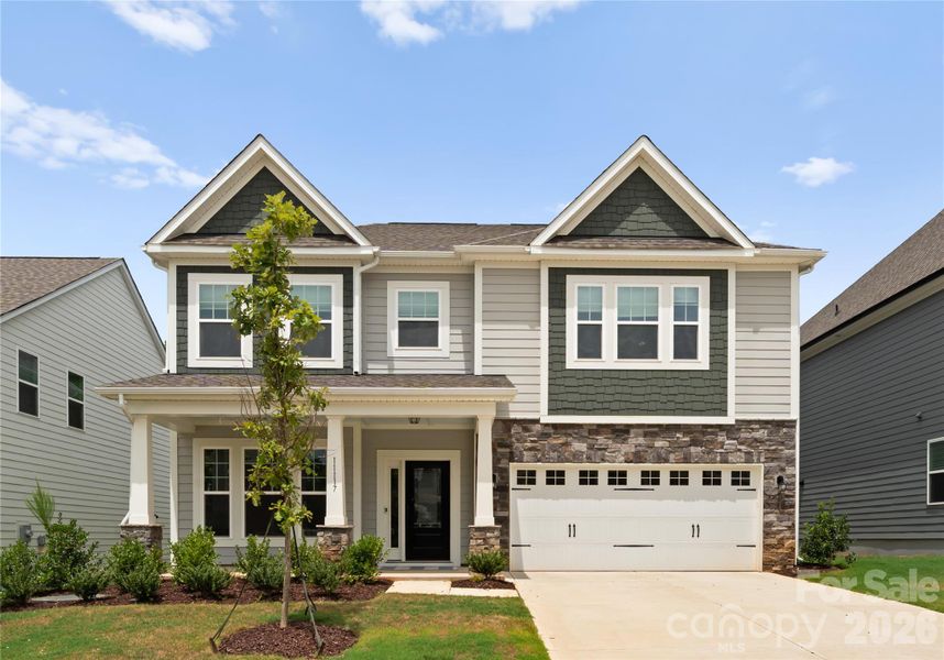 Front exterior of a new home in Avienmore, Charlotte, NC, highlighting curb appeal (Image 1). Front exterior of a new home in Avienmore, Charlotte, NC, highlighting curb appeal (Image 1).