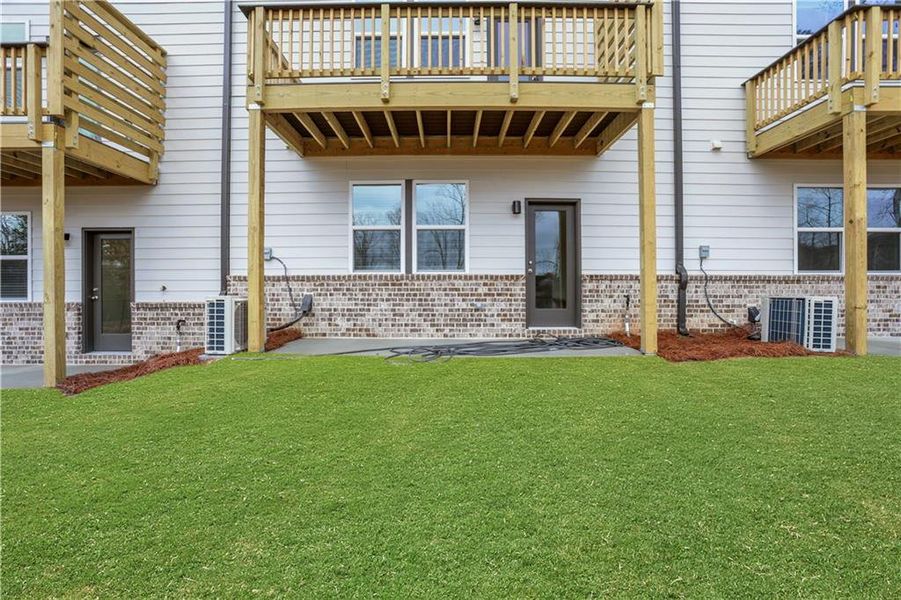 Exterior details and patio area of a home in Towne Village at Suwanee Dam, Sugar Hill (Image 29).