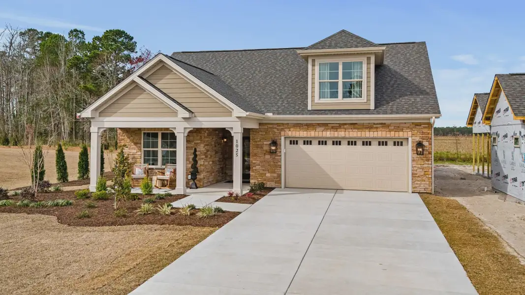 Representative exterior photo of a completed home built from the Portico by Epcon Communities in Courtyards by Carrell, Ocean Isle Beach, NC (Image 22). Representative exterior photo of a completed home built from the Portico by Epcon Communities in Courtyards by Carrell, Ocean Isle Beach, NC (Image 22).