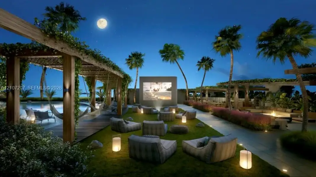 Outdoor movie theater with hammocks and sofas to enjoy a film under the stars Outdoor movie theater with hammocks and sofas to enjoy a film under the stars