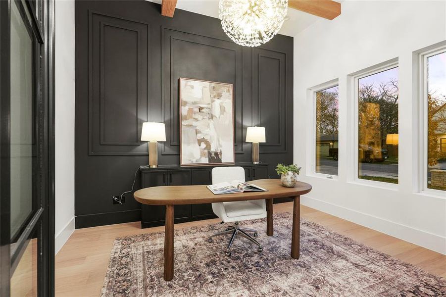 Home office featuring a chandelier, light wood-style floors, and beamed ceiling