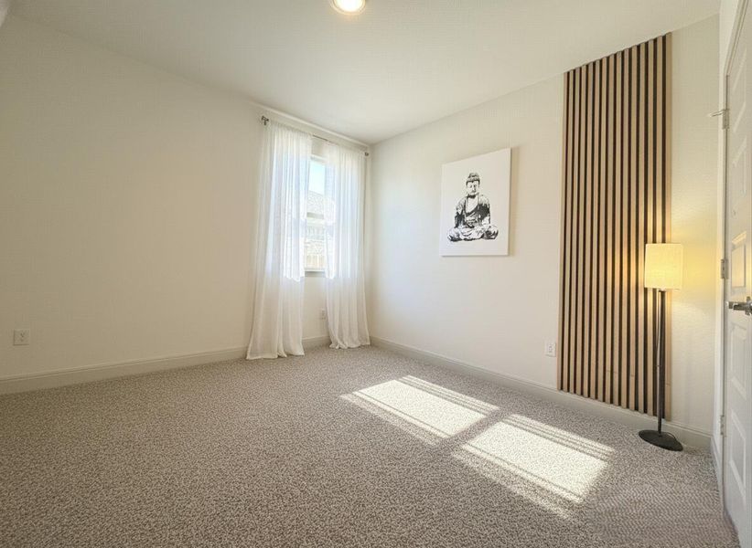 Empty room with carpet flooring and baseboards