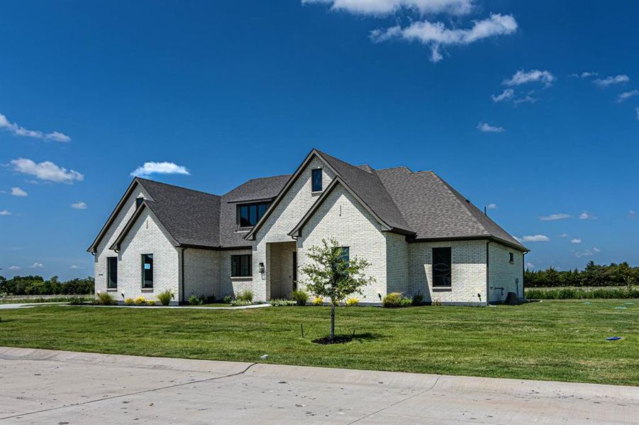 Front exterior of a new home in , Caddo Mills, TX, highlighting curb appeal (Image 22). Front exterior of a new home in , Caddo Mills, TX, highlighting curb appeal (Image 22).